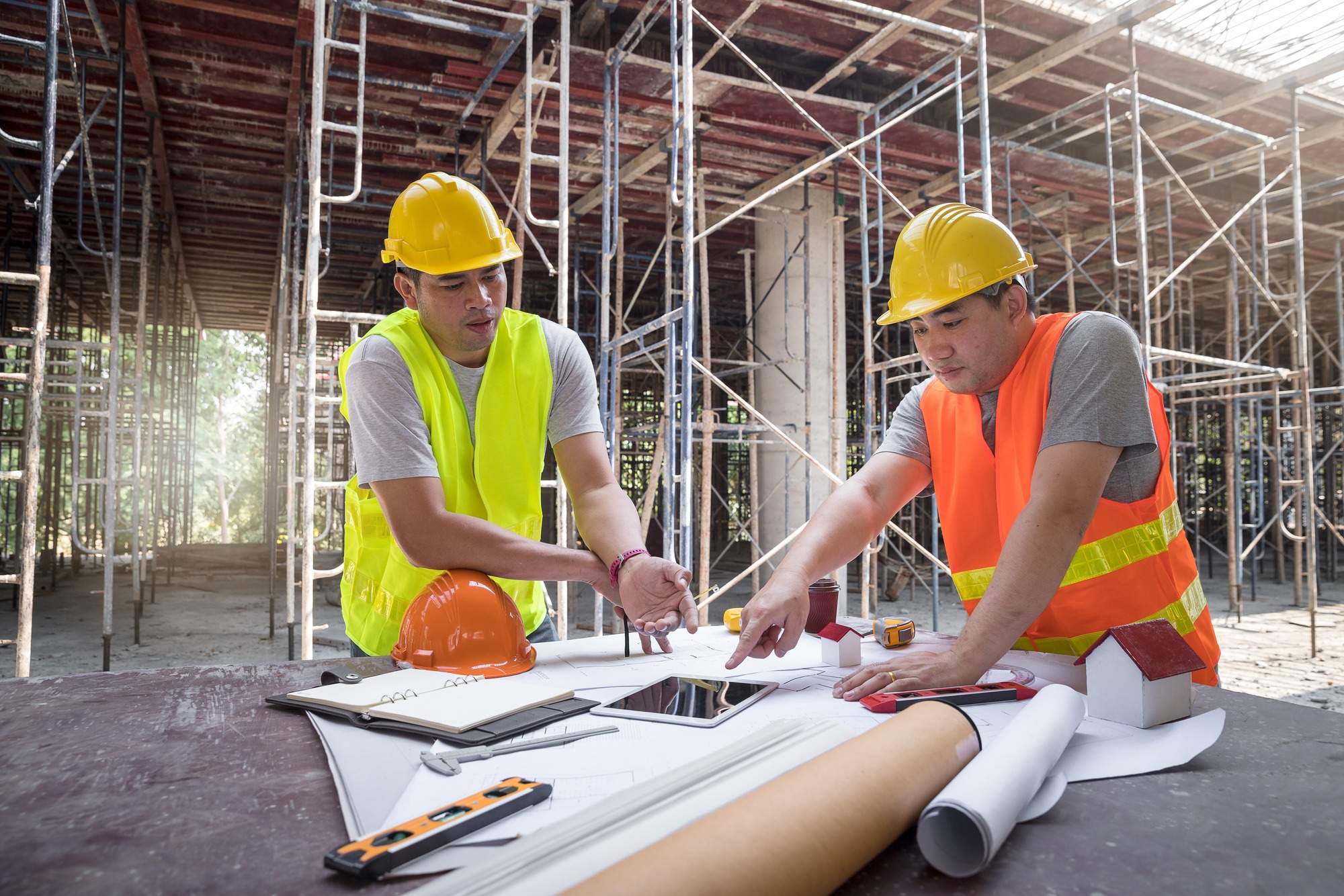 Confident team of architect working together in building construction site.