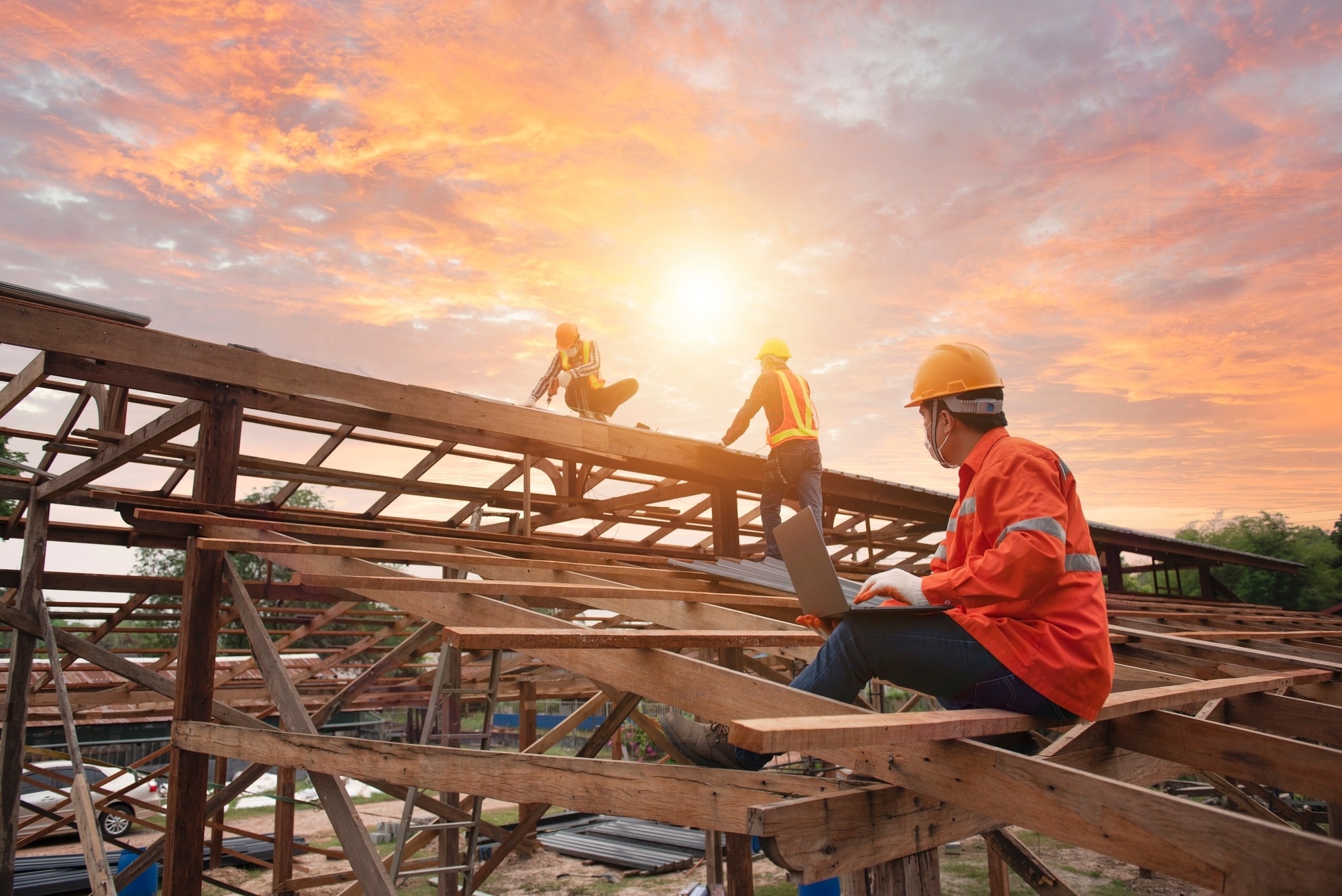 Engineer inspects, installers, repairs roofs above the clouds, blue sky
