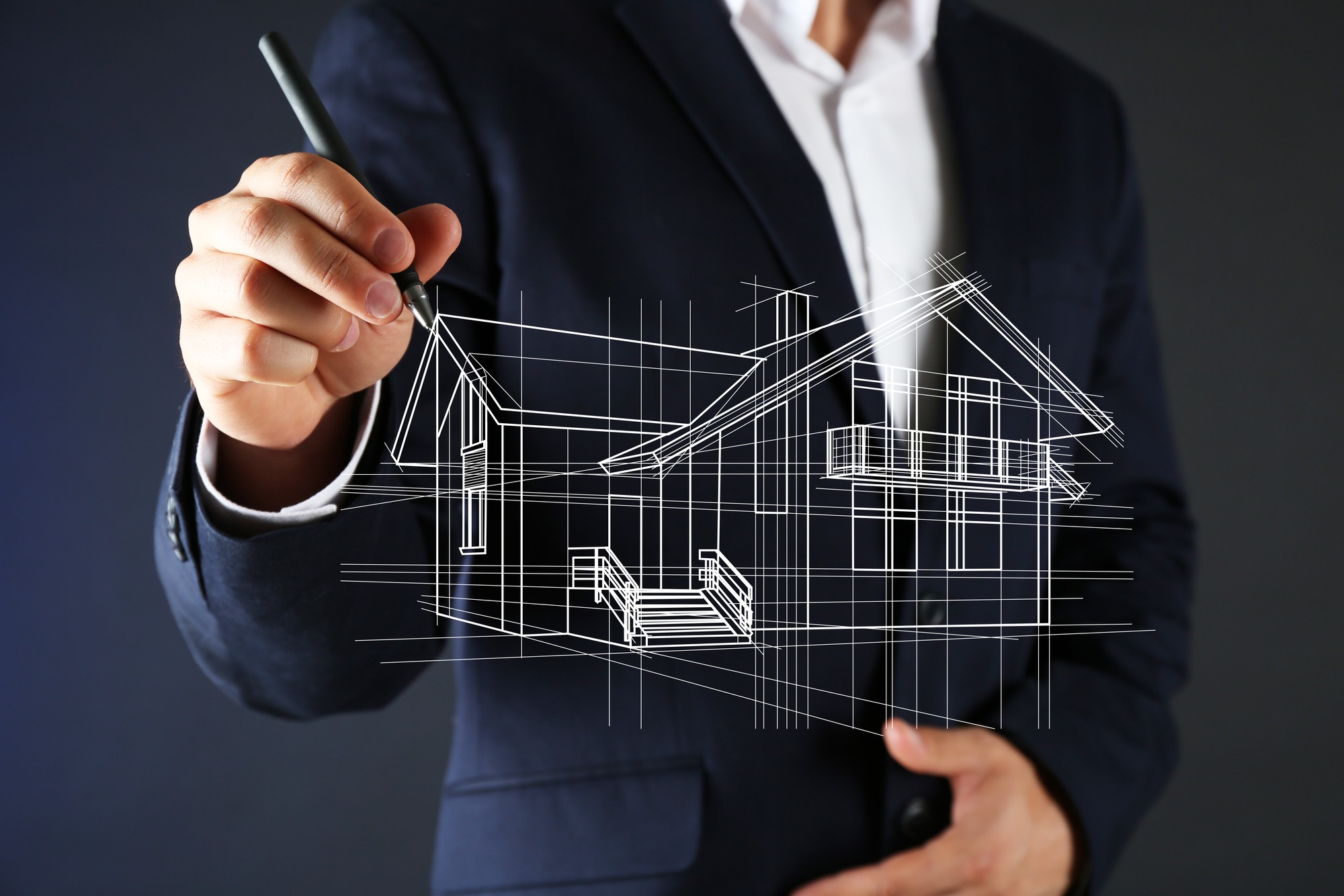 Real estate offer. Businessman drawing a model of the house